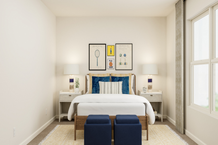 A room with a bed and chairs.