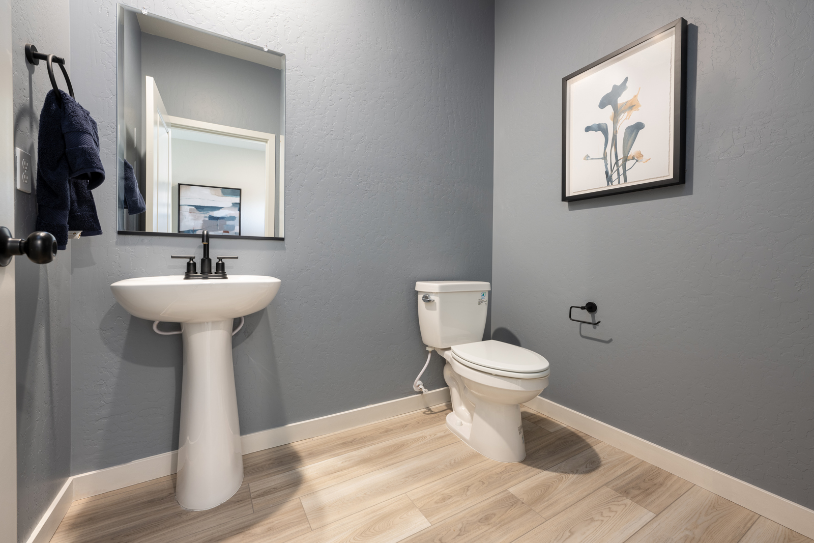 A bathroom with a toilet and sink.