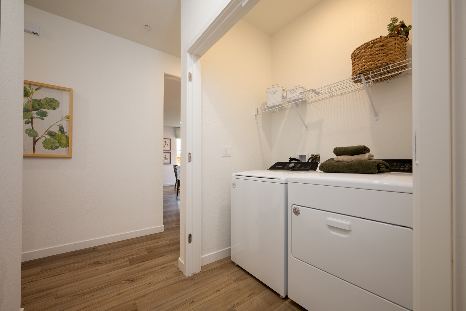 A room with white cabinets and a white counter top.