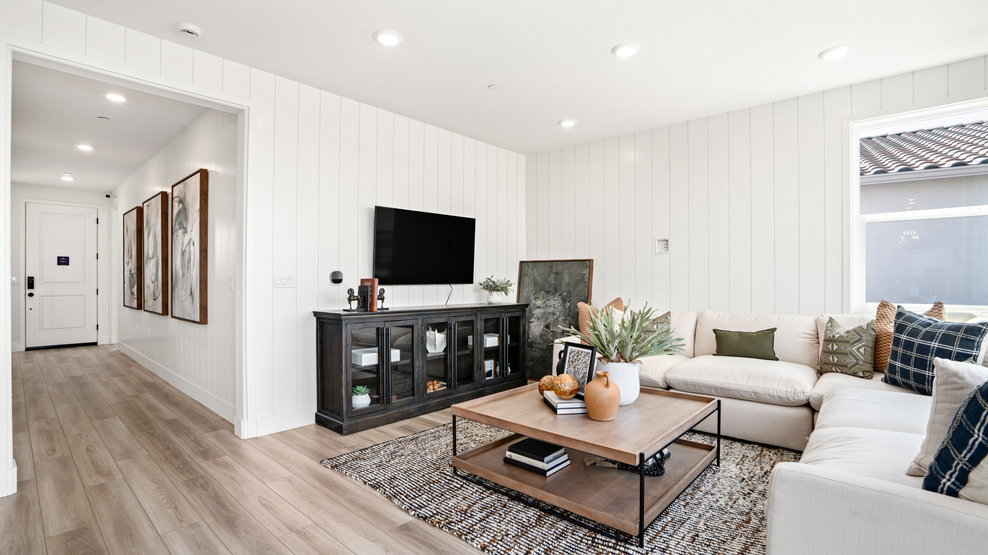 A living room with a tv and couches.