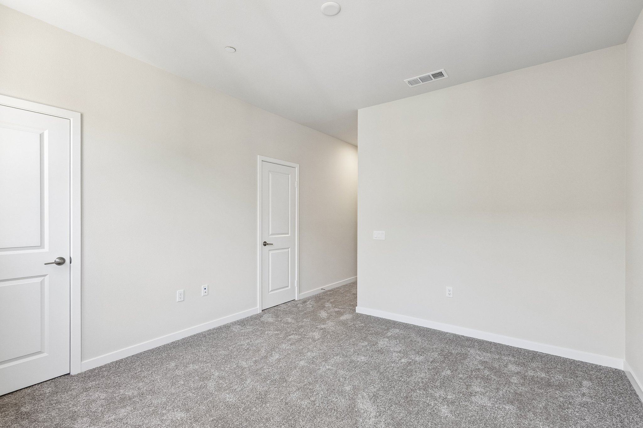 A room with white doors.