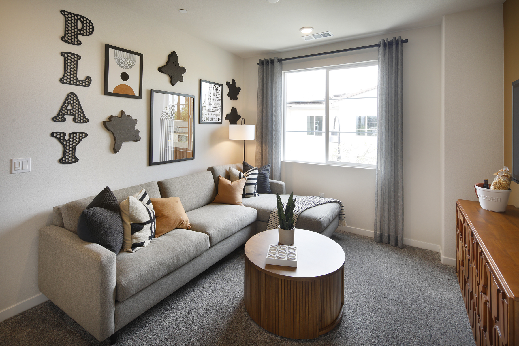 A living room with a couch and a coffee table.