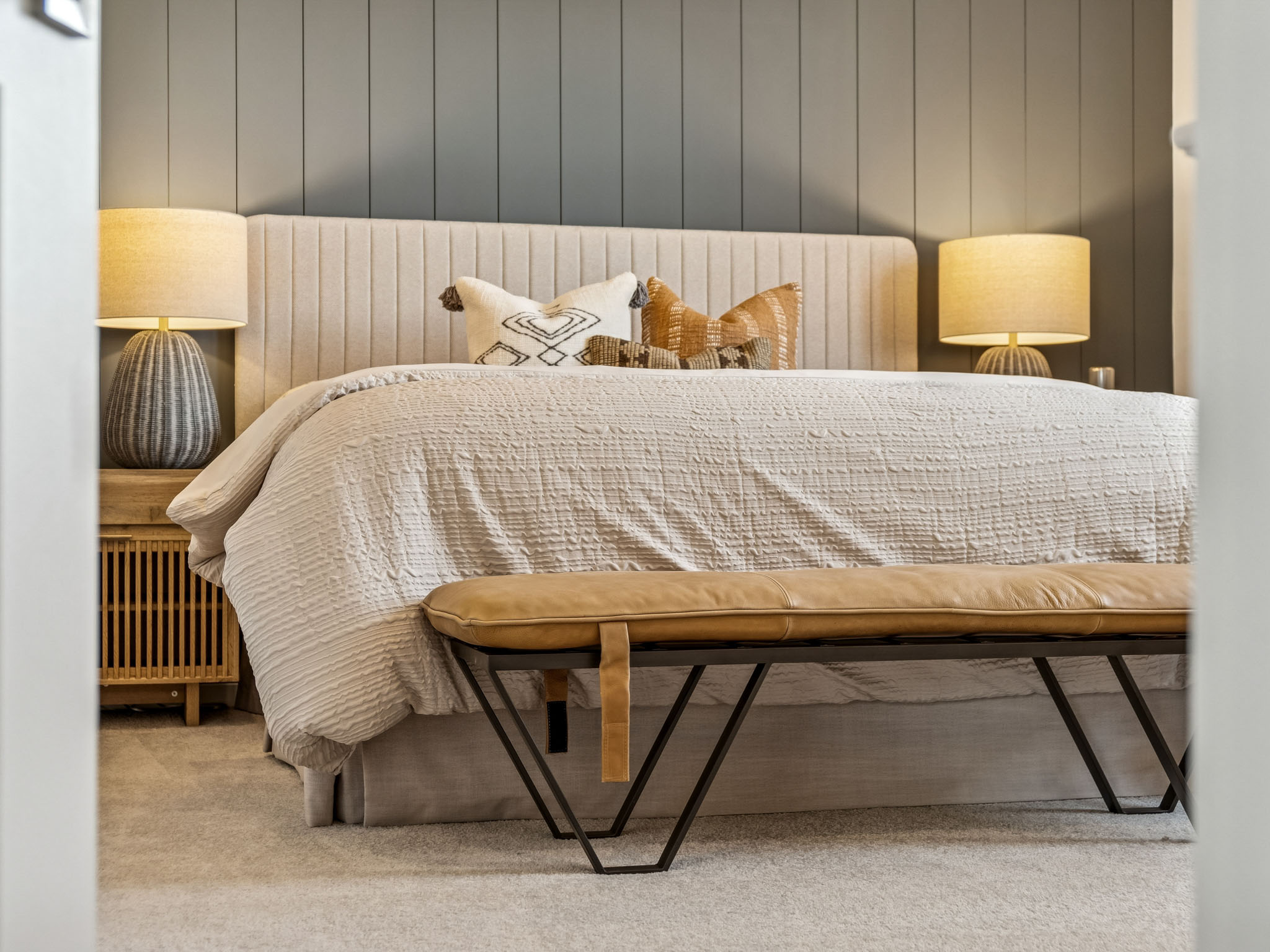 A bed with a blanket on it.