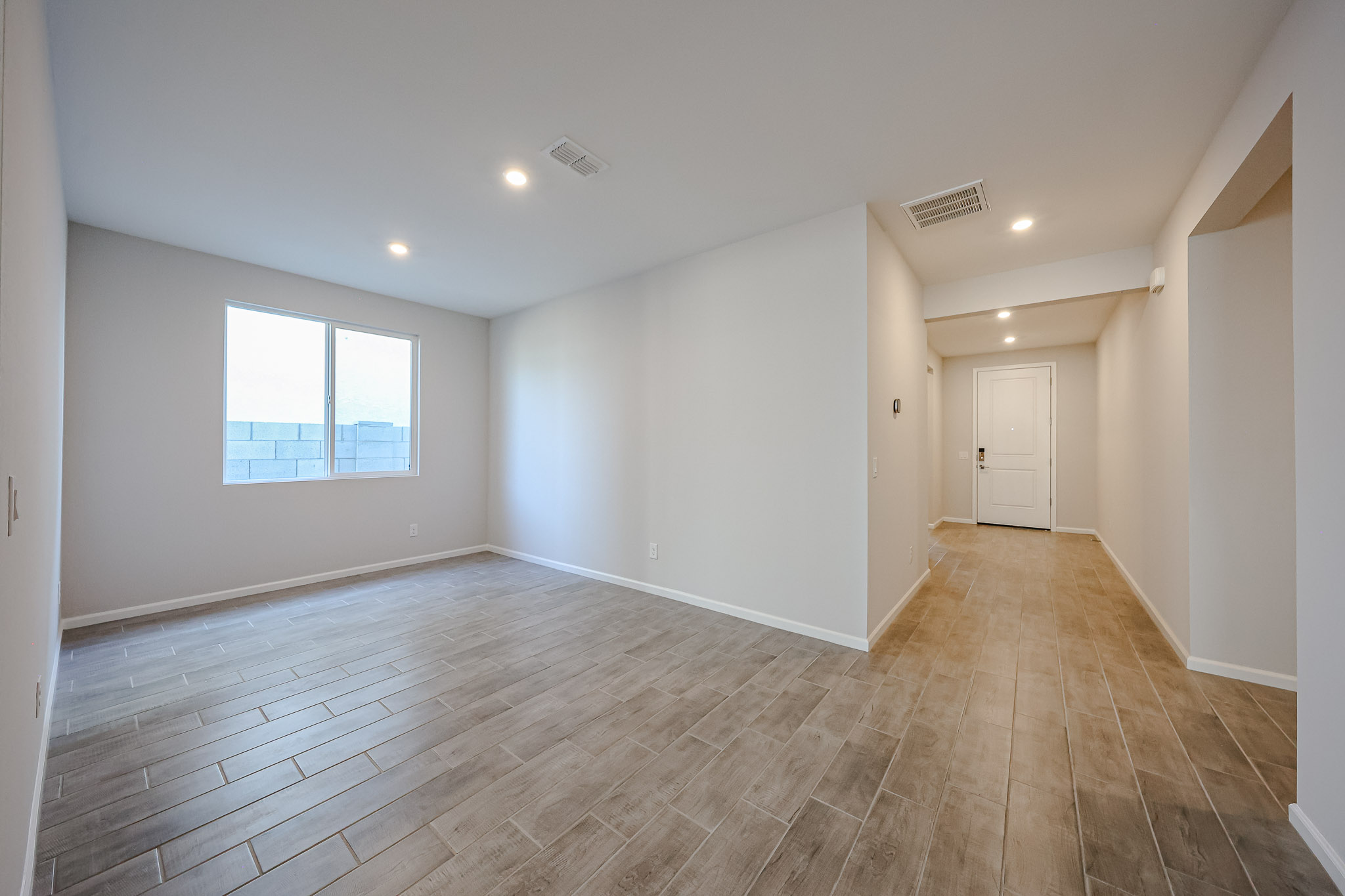 A room with a wood floor and a wood floor.