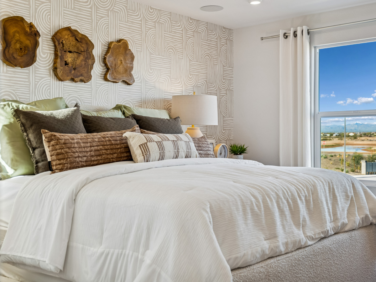 A bed with pillows and pillows.