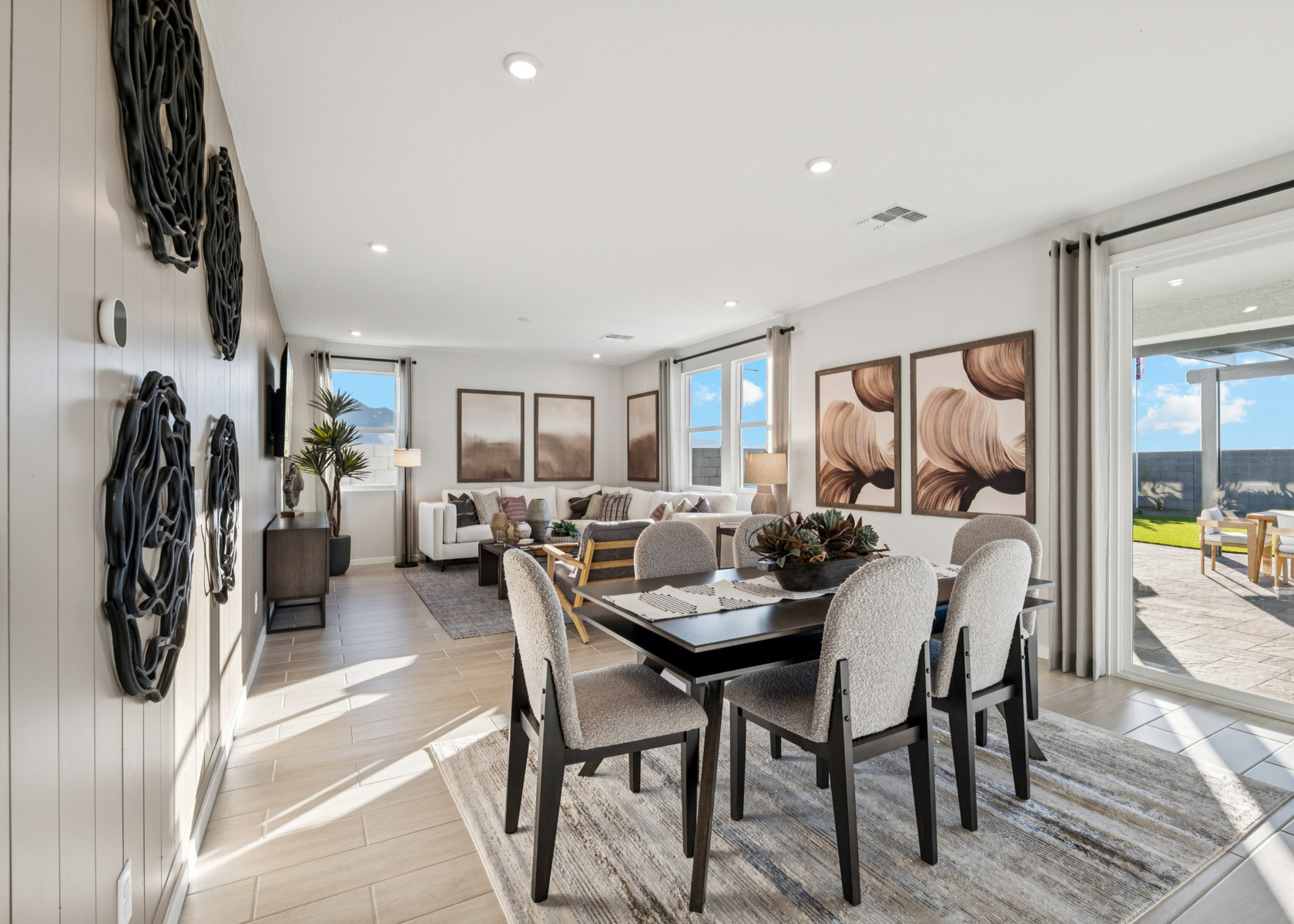 A dining room with a large window.