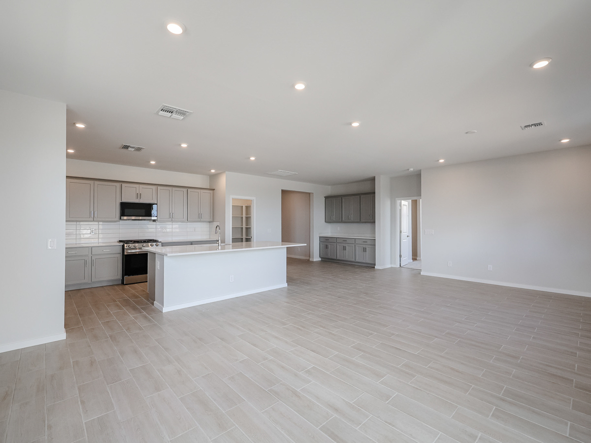 A large kitchen with white cabinets.