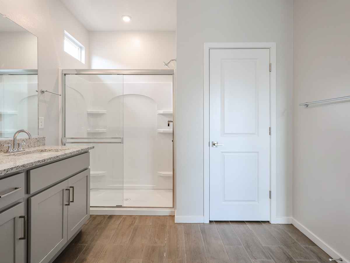 A bathroom with a glass shower.