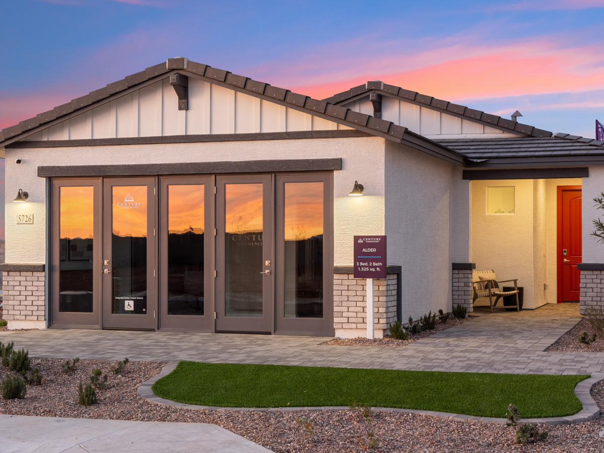 A building with a lawn in front.