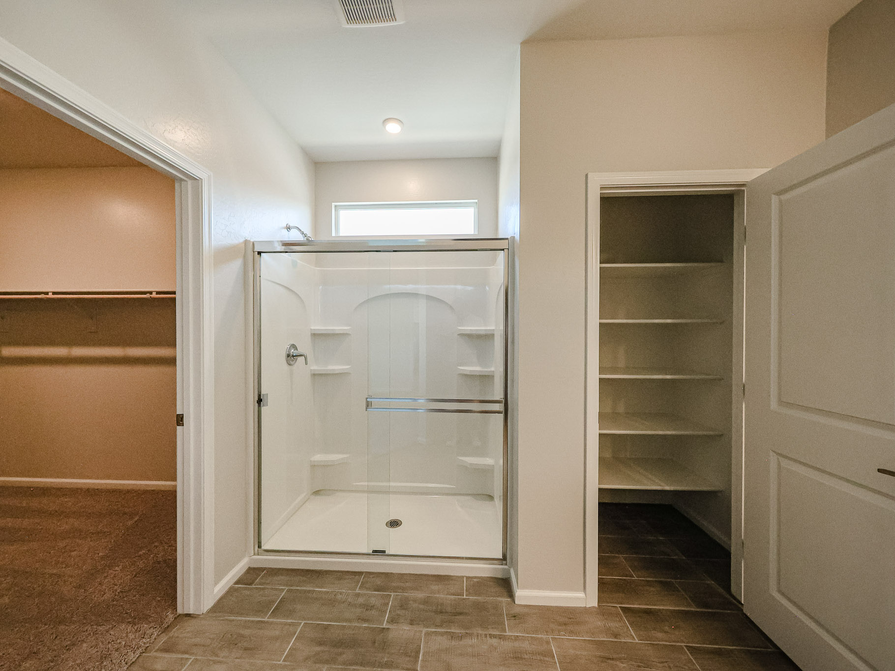 A bathroom with a glass shower.