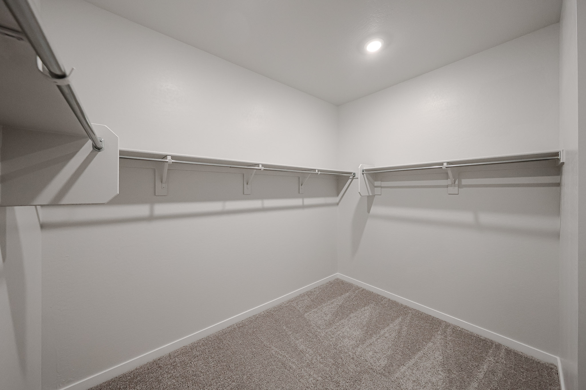 A hallway with white walls.