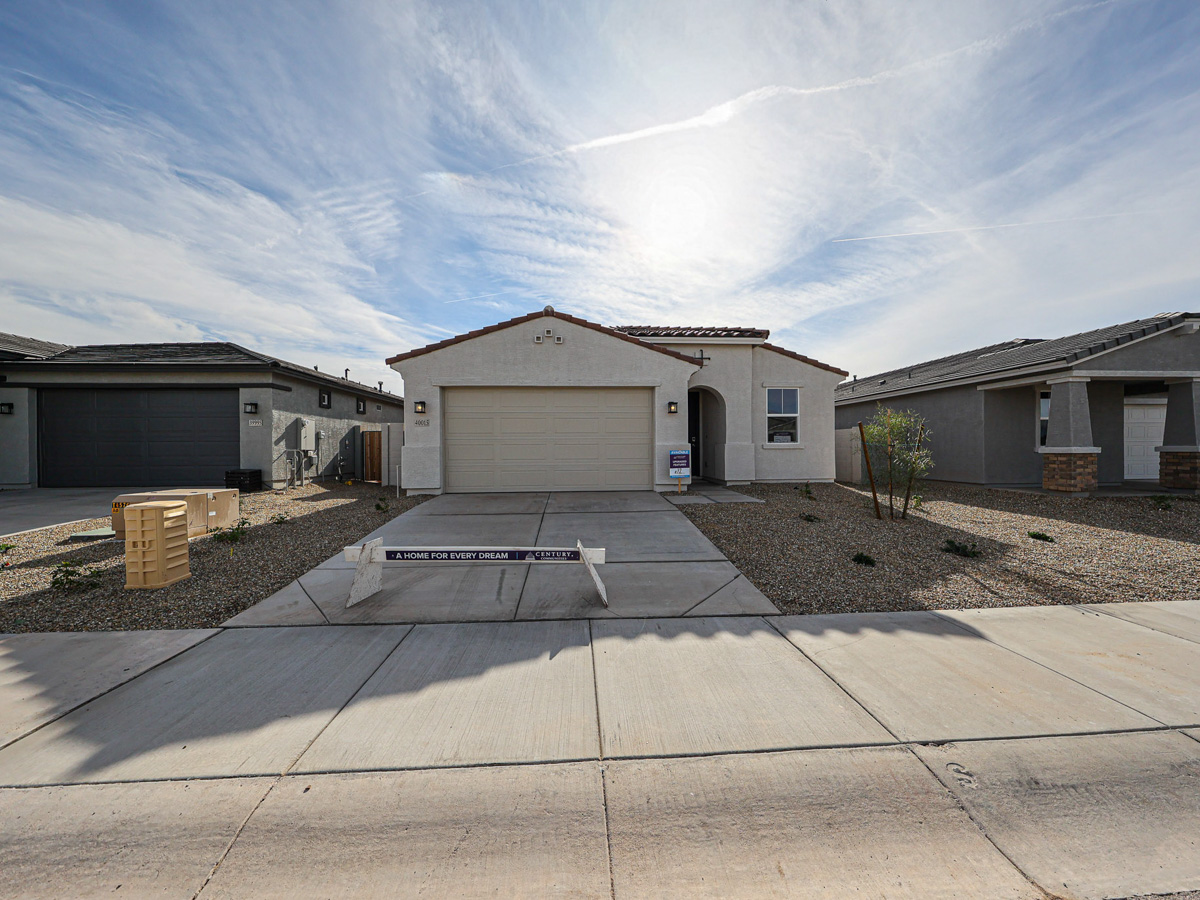 A group of buildings with a parking lot in front of them.