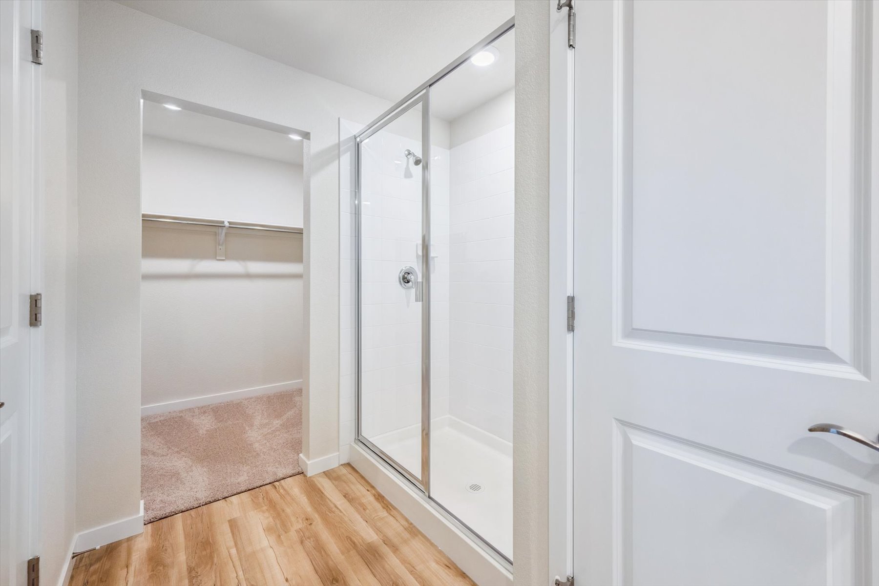 A bathroom with a glass shower.