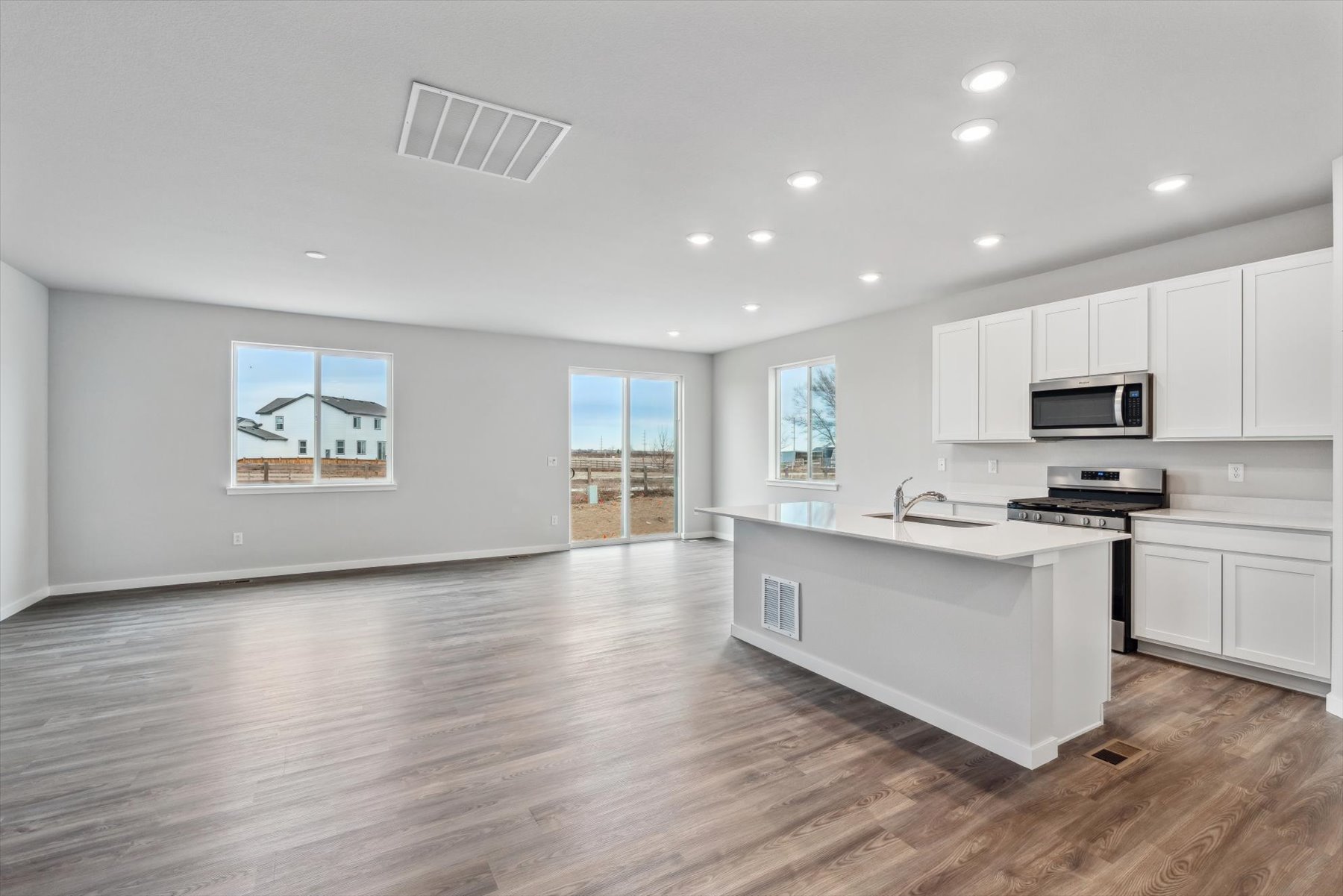 A large kitchen with white cabinets.