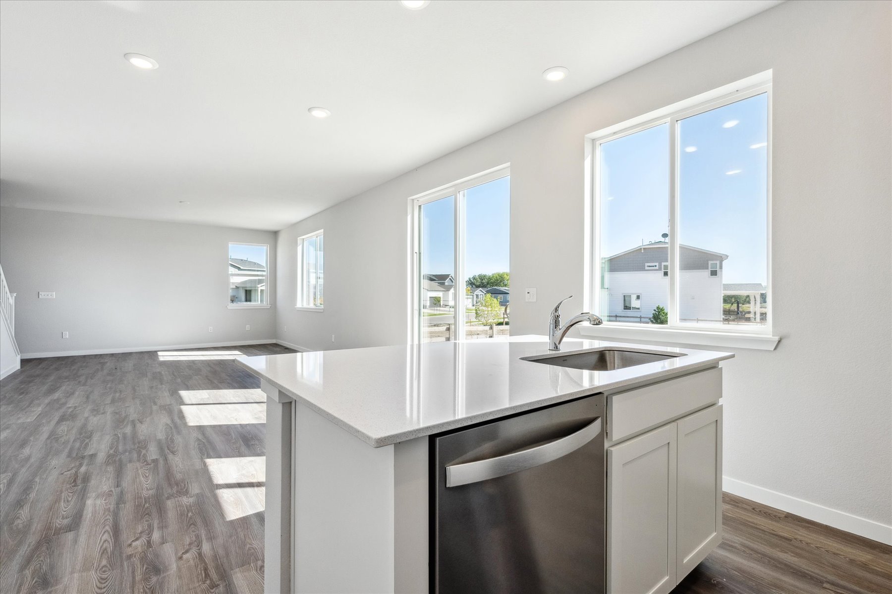 A kitchen with a sink and a window.