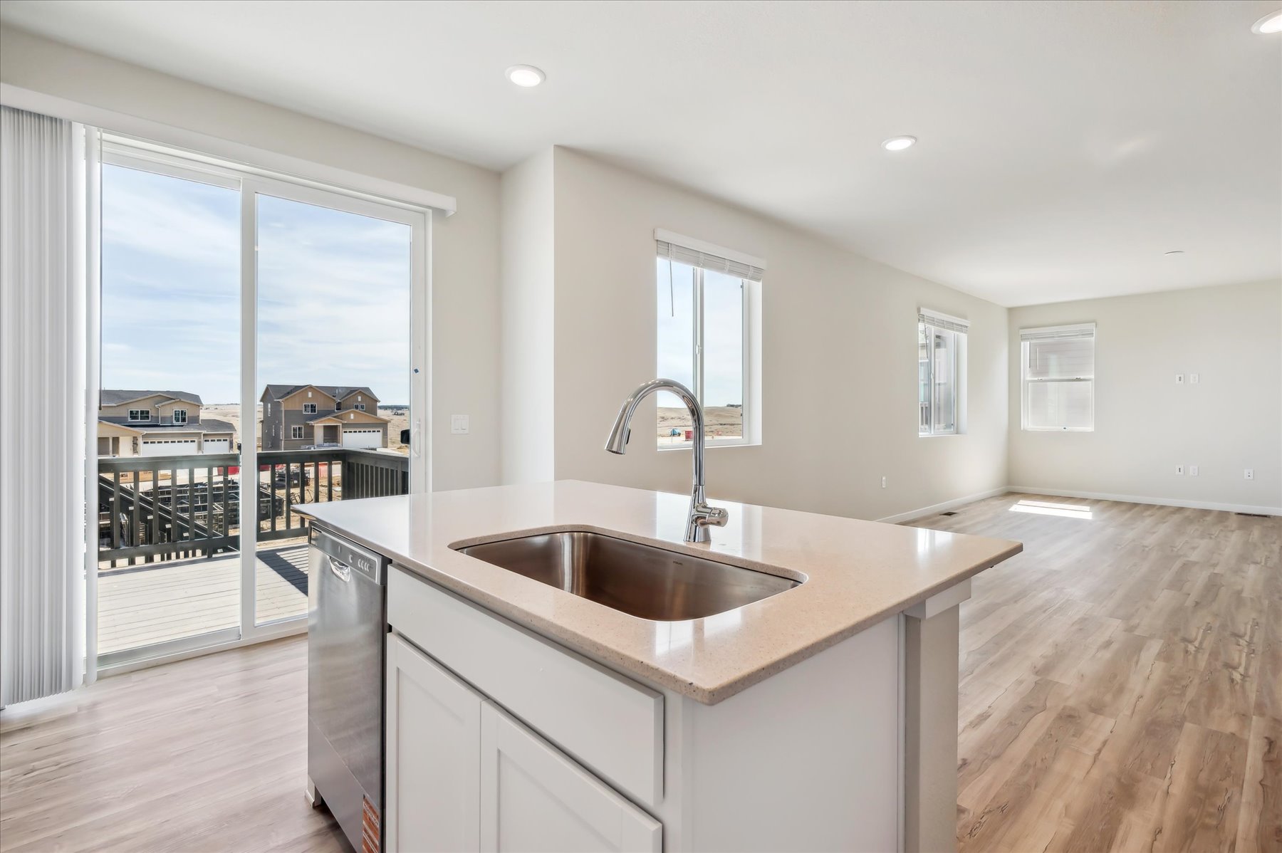 A kitchen with a large window.