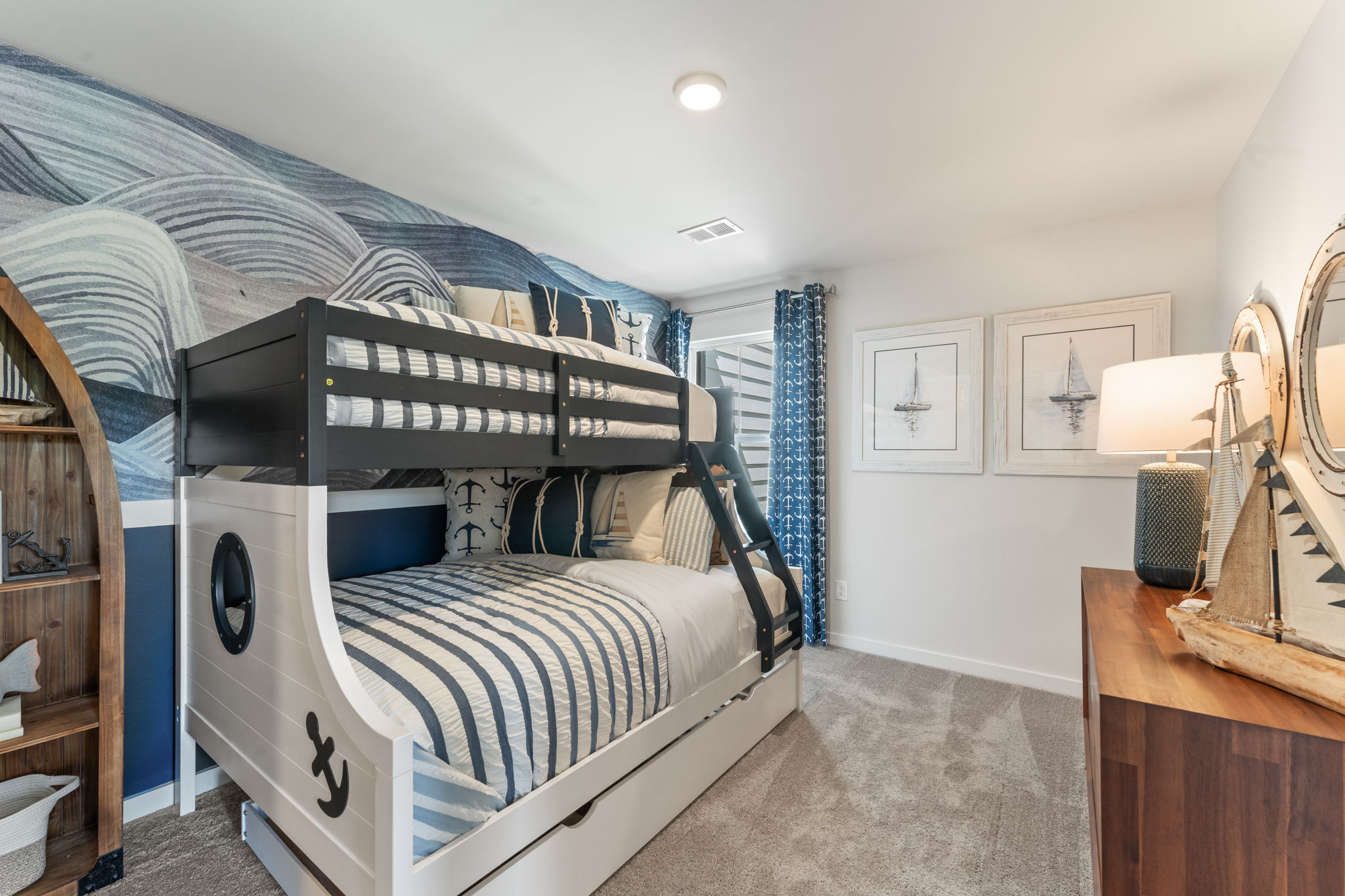 A bedroom with a bed and a mirror.