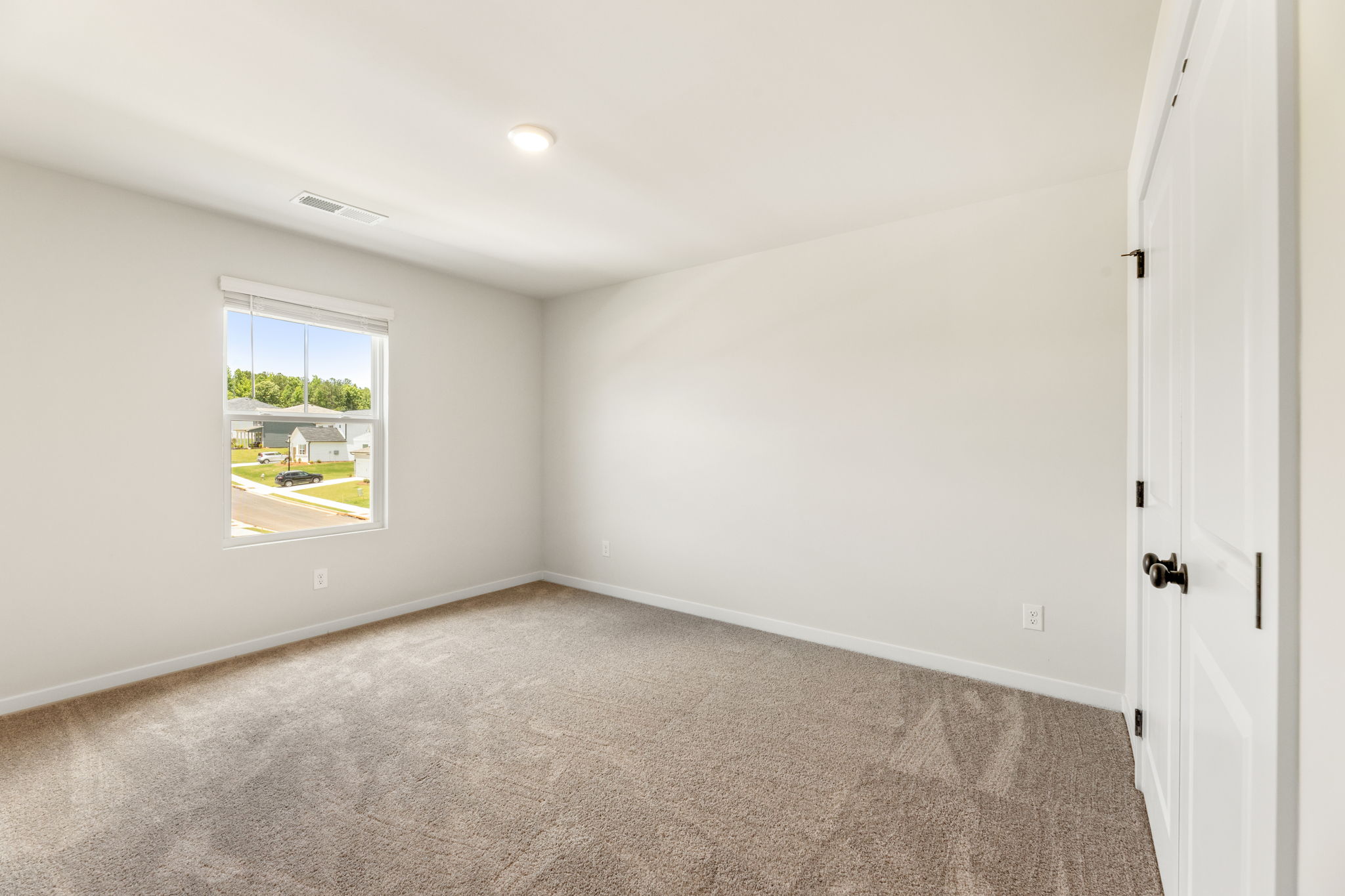 A room with a door and a window.