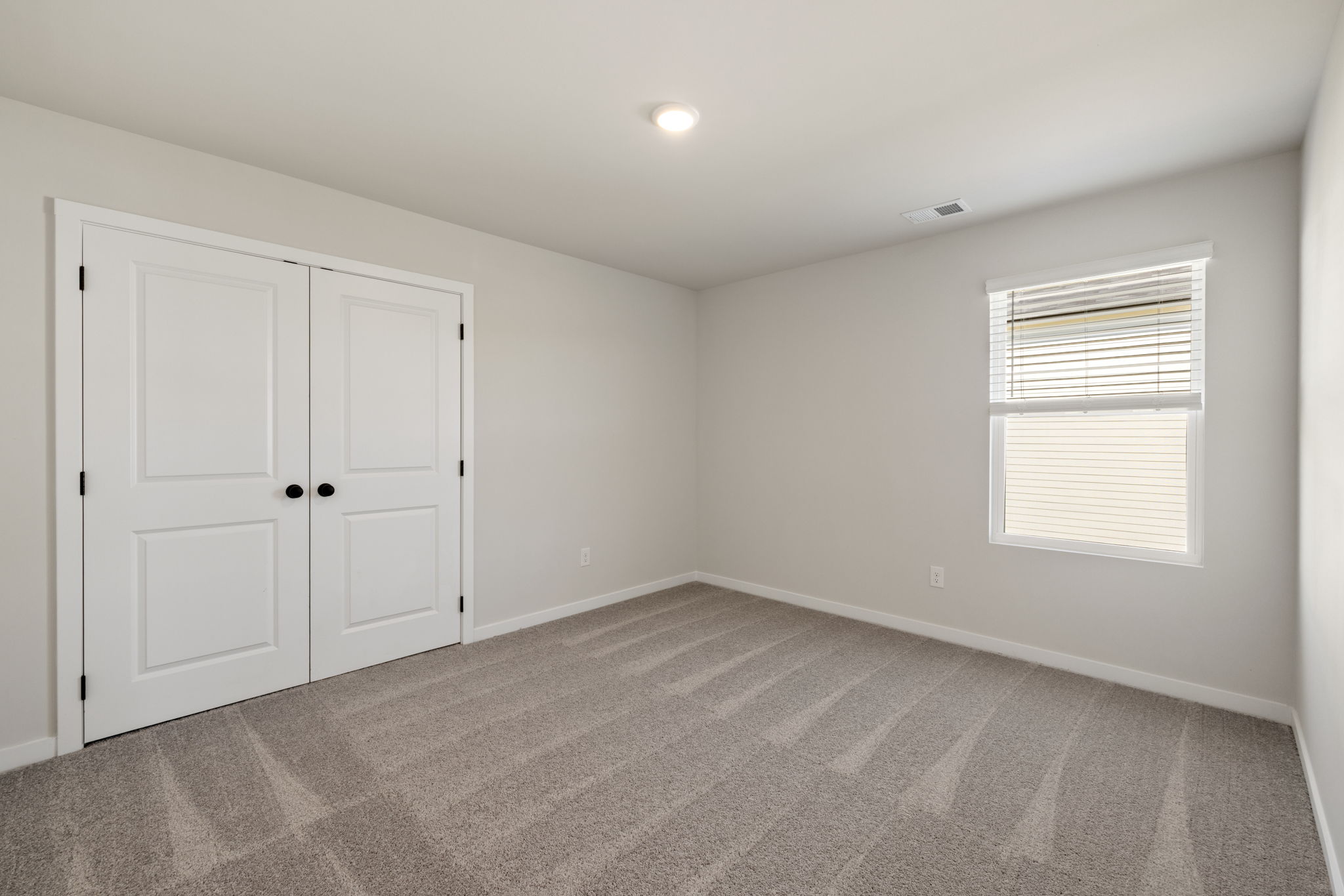 A room with white doors.