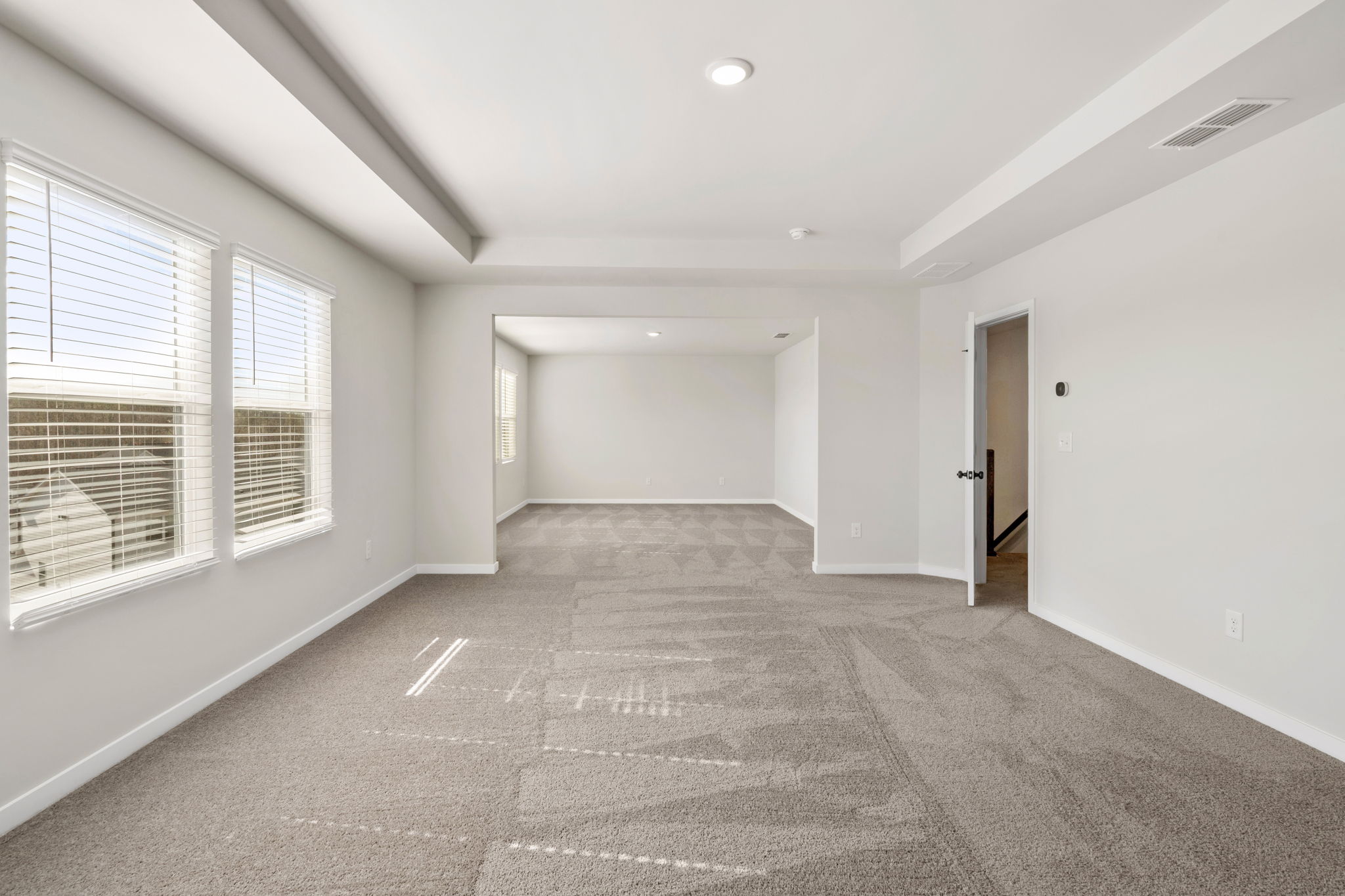 A long hallway with windows.