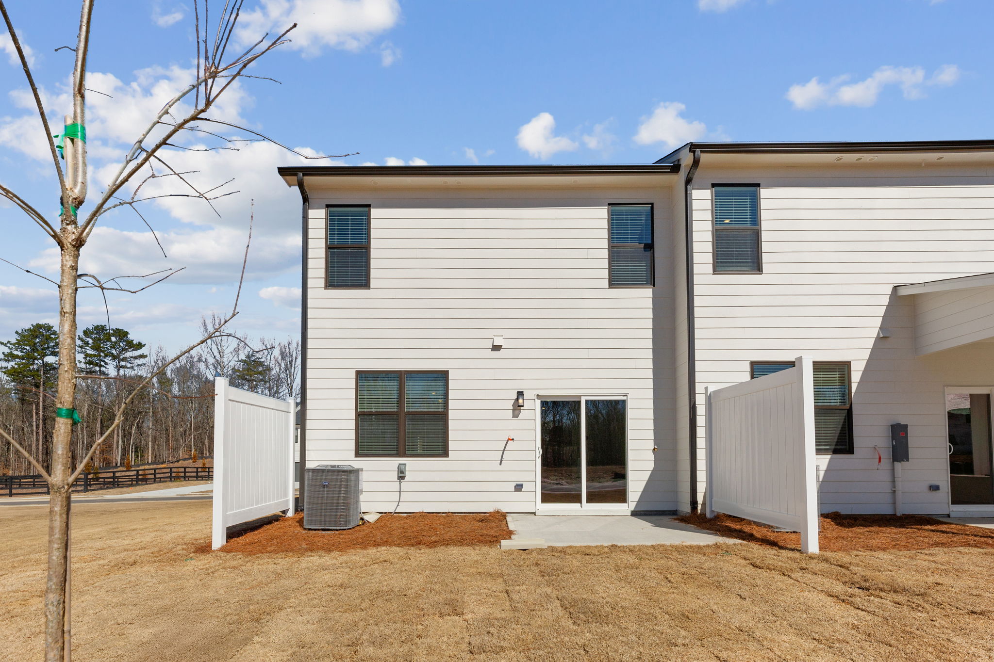 A white house with a fence.