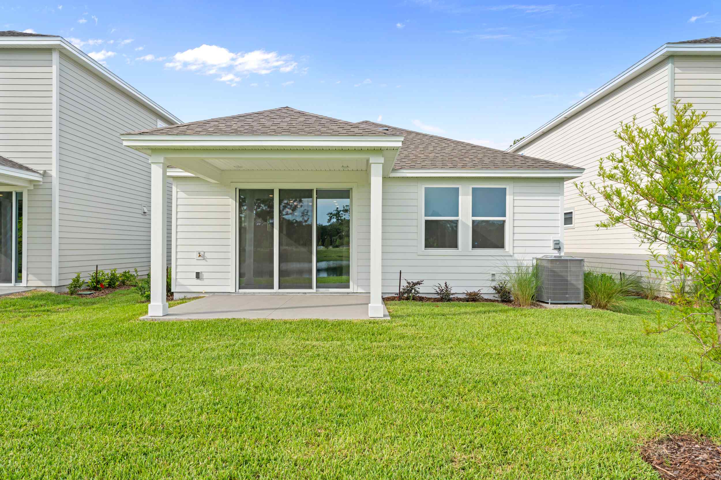 Miramar Floorplan Lot 81 Backyard with Covered Patio at Concourse Crossing in Fernandina Beach
