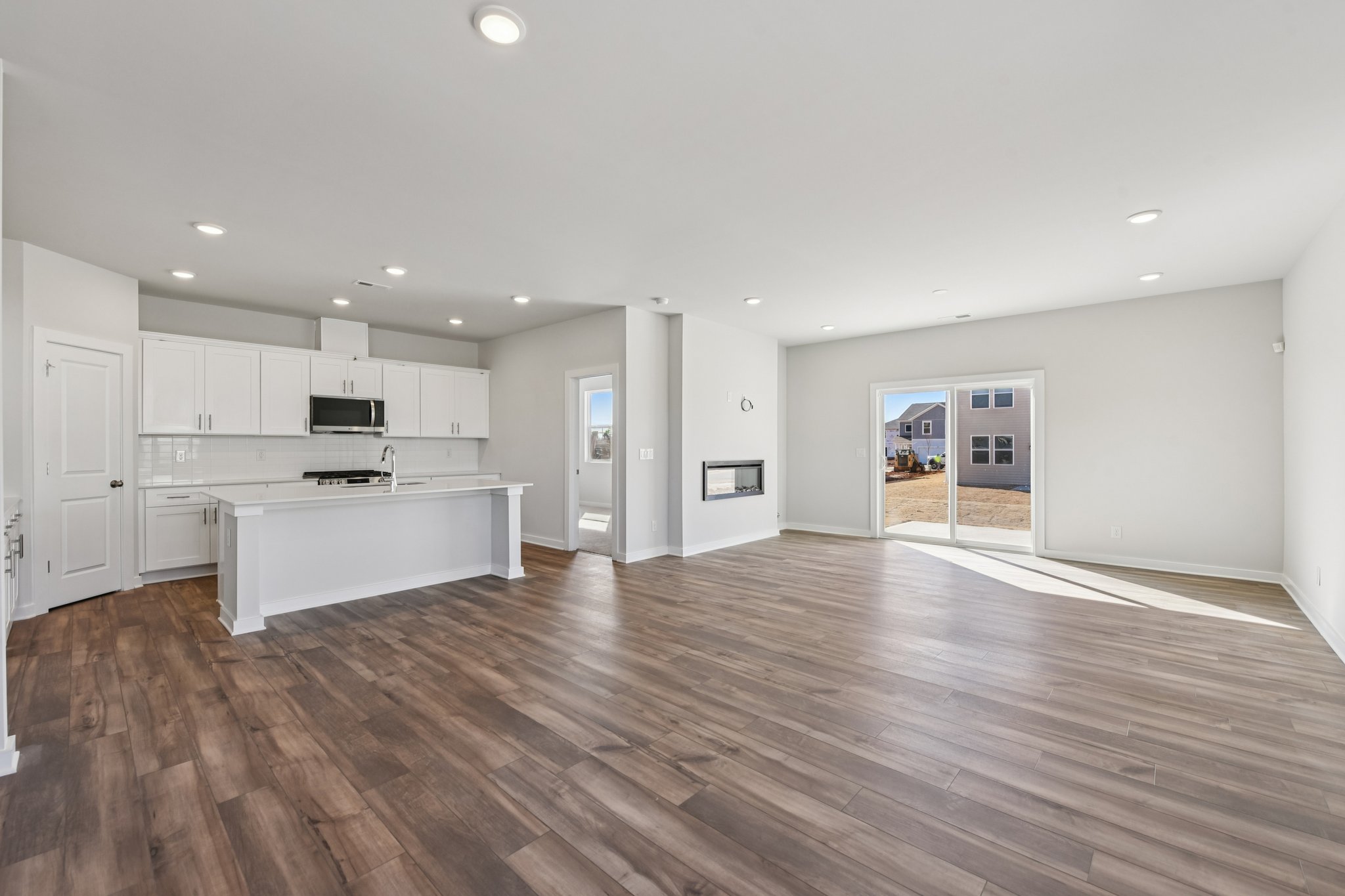 A large kitchen with white cabinets.