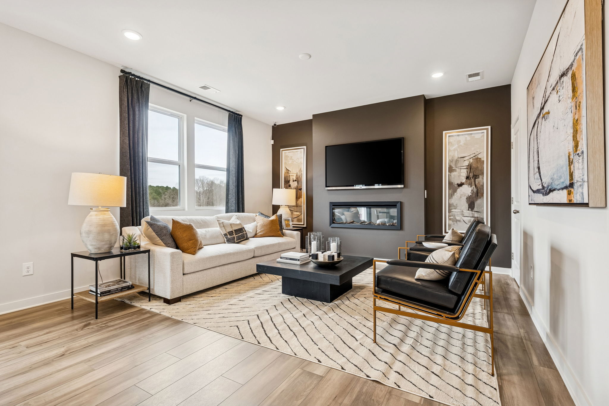 A living room with a wood floor.