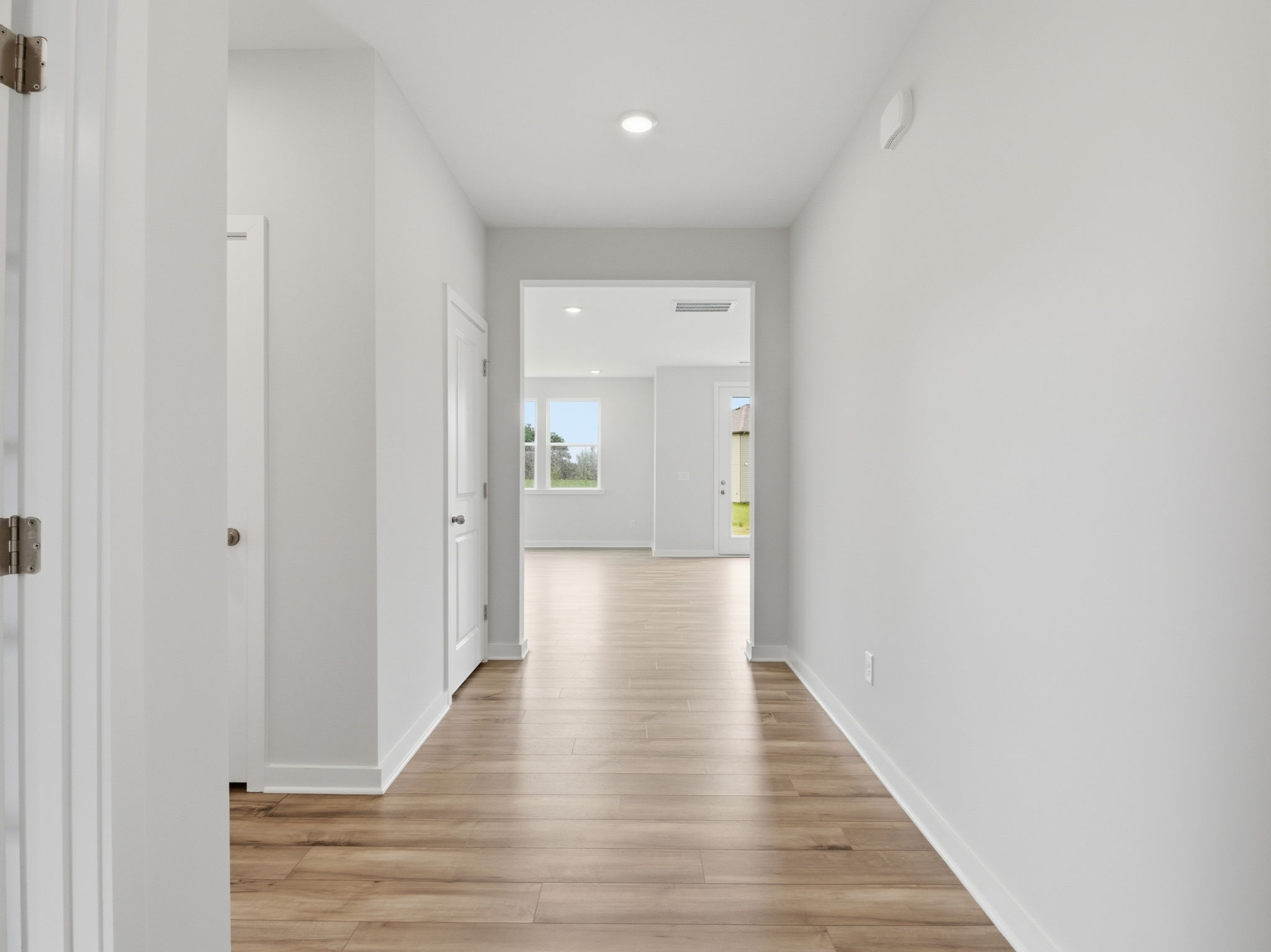 A hallway with white doors.