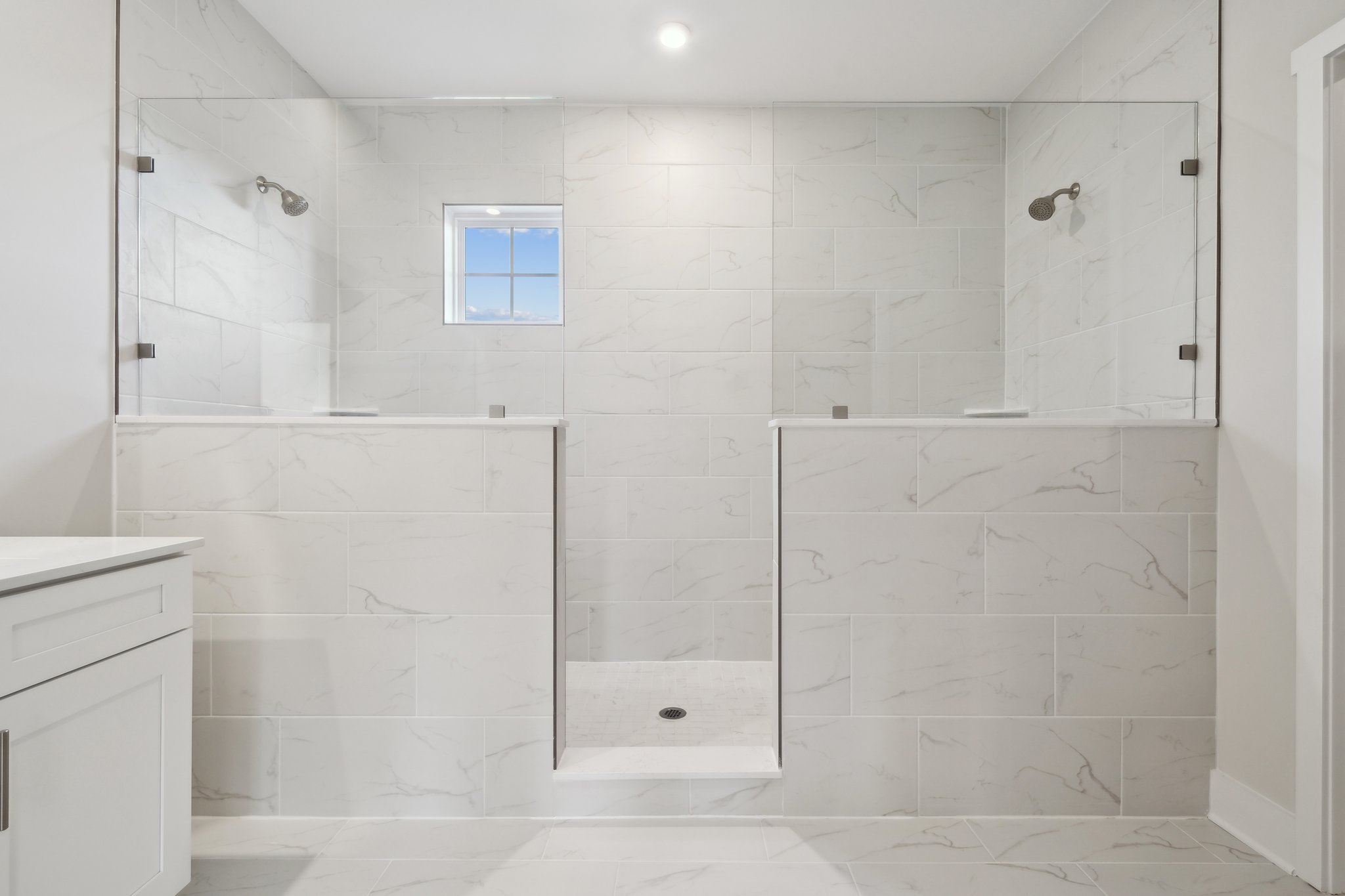 A bathroom with a tile floor.