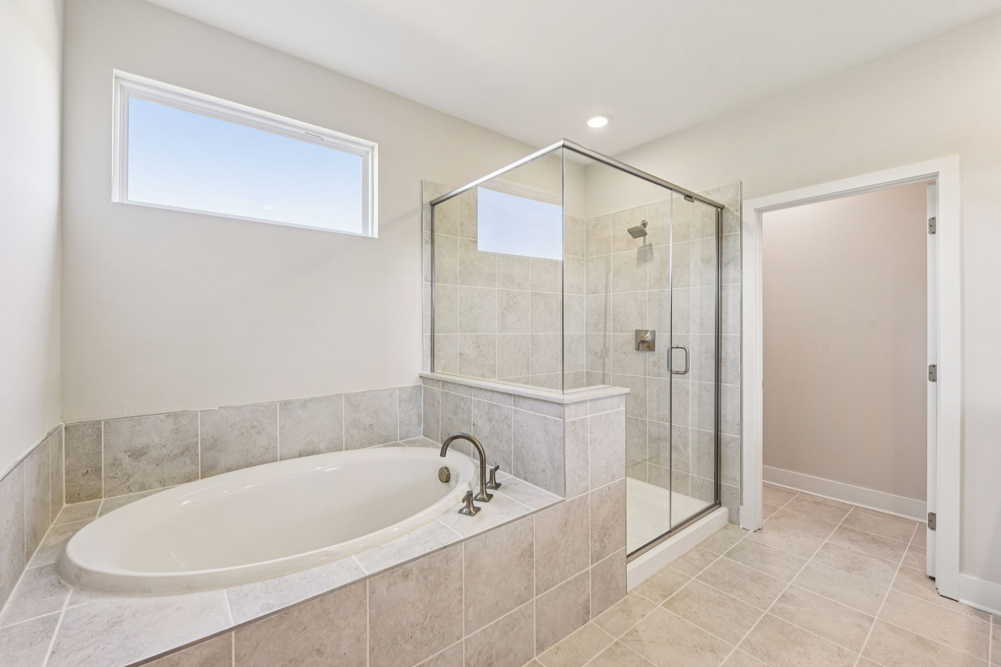 A bathroom with a glass shower.