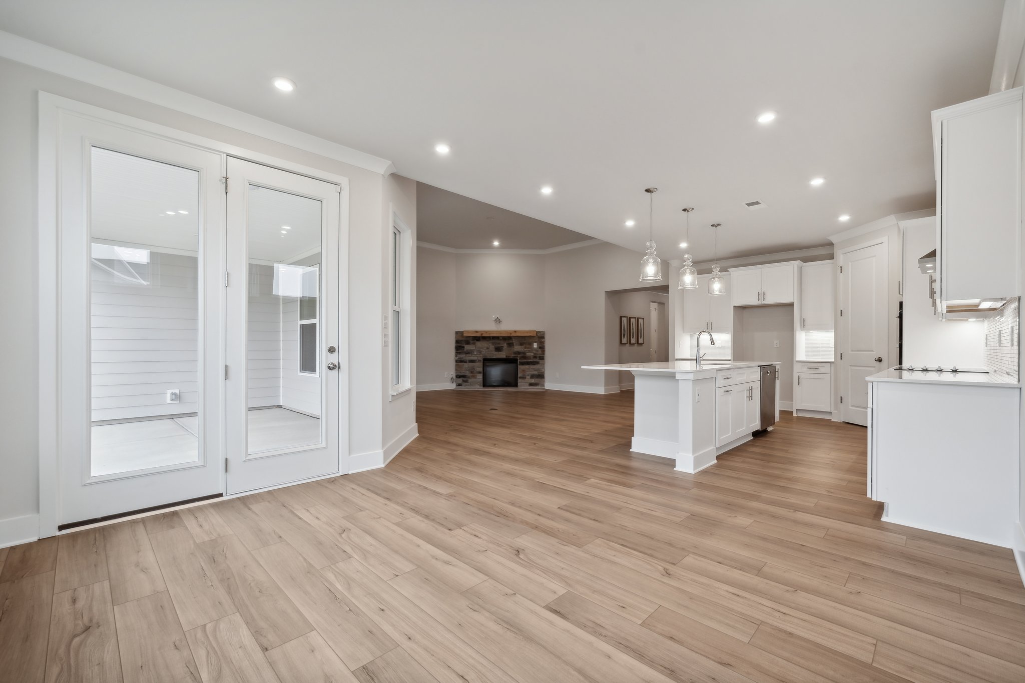 A large kitchen with white cabinets.