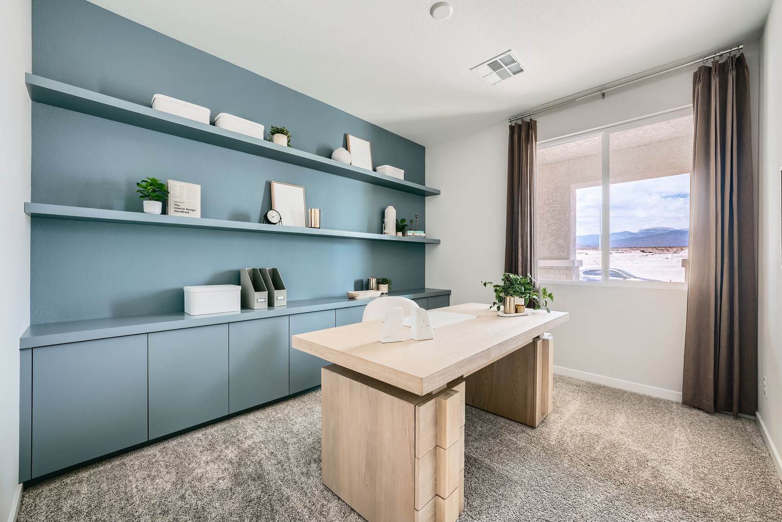 A room with a counter and shelves.
