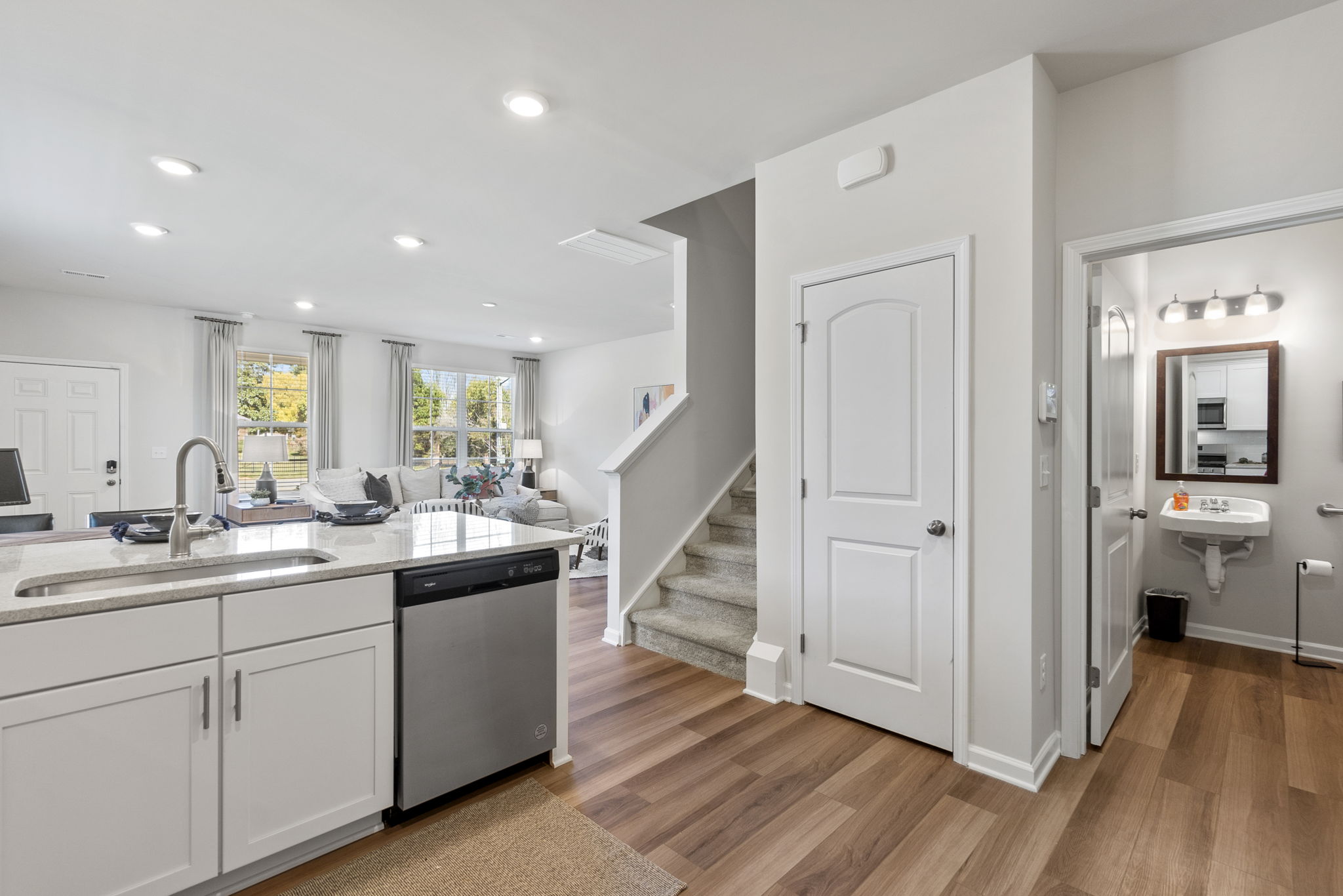 A large kitchen with white cabinets.