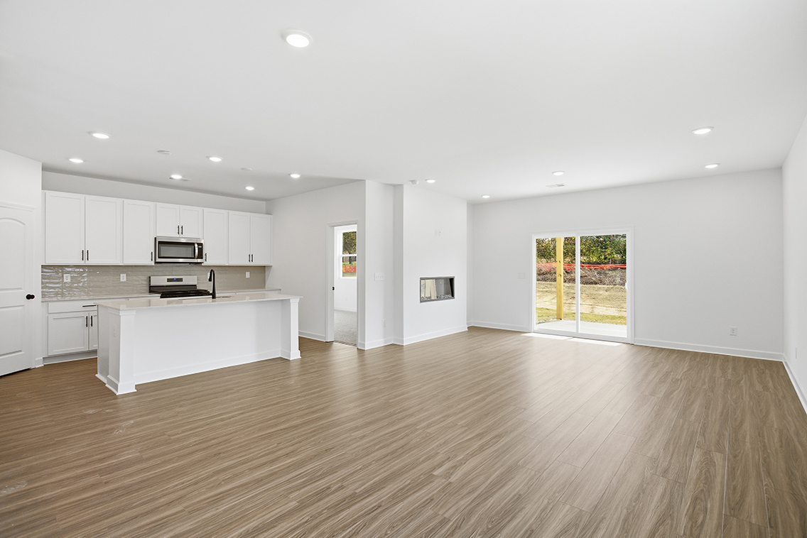 A large kitchen with white cabinets.