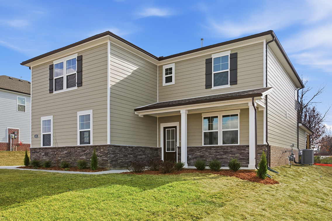 A house with a lawn in front.