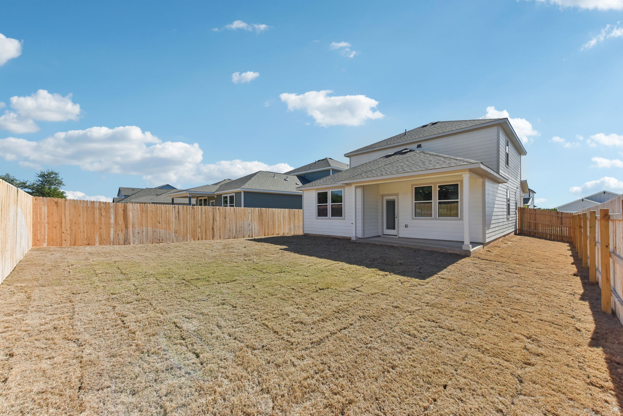 A house with a fence around it.
