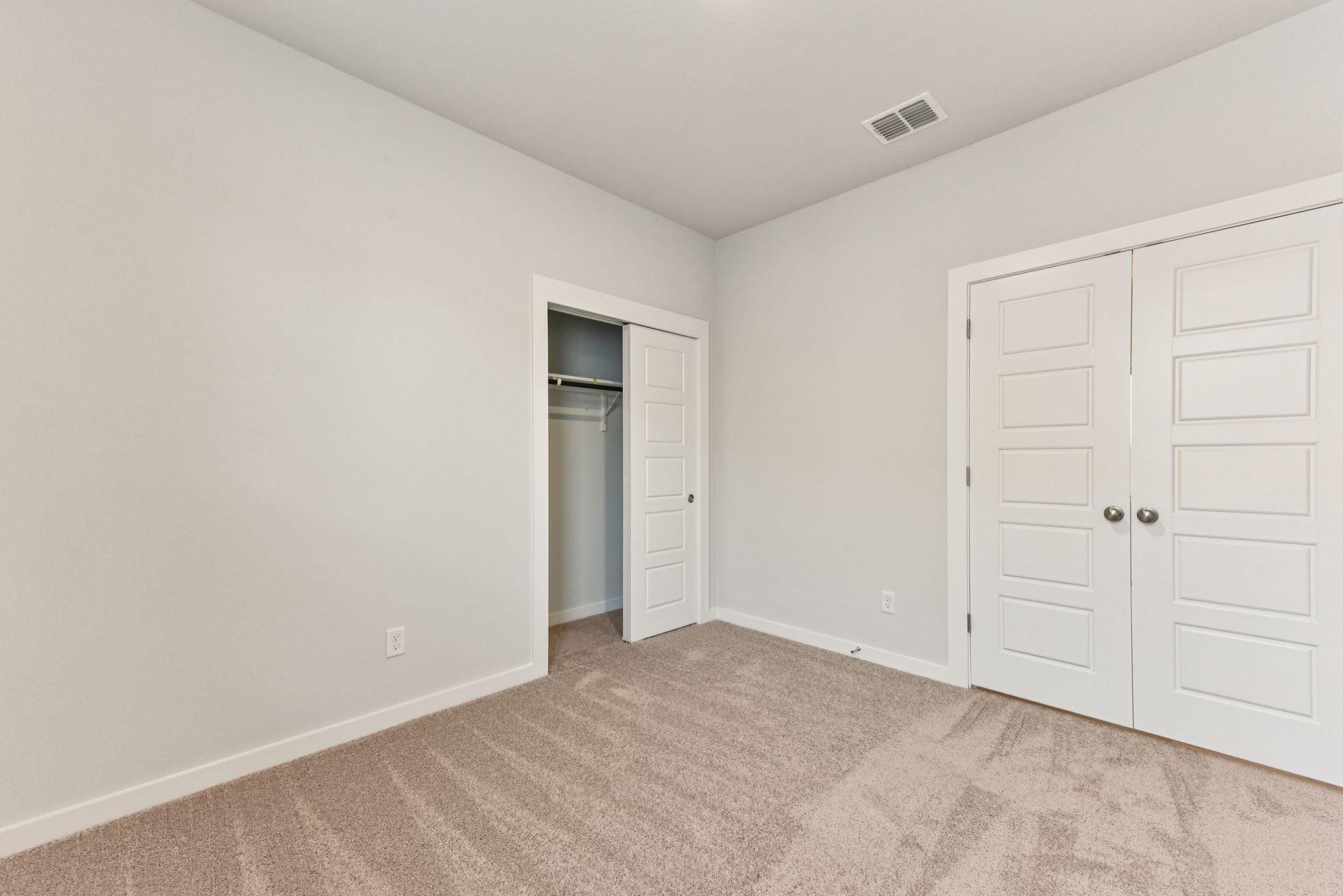 A room with white doors.