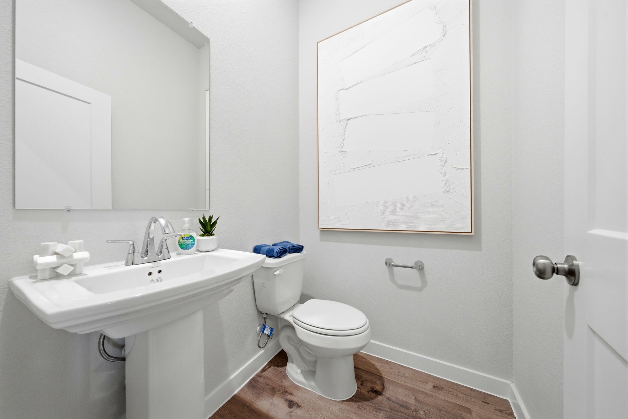 A bathroom with a toilet and sink.