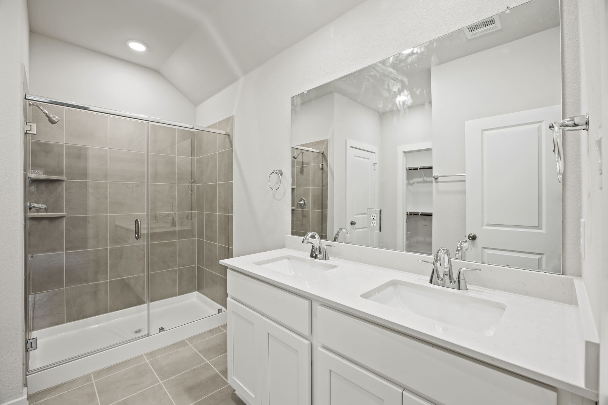A bathroom with a glass shower.