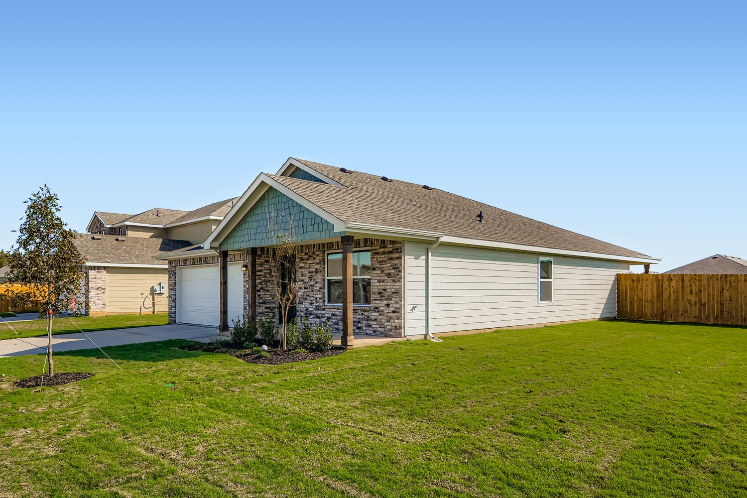 A house with a grass yard.