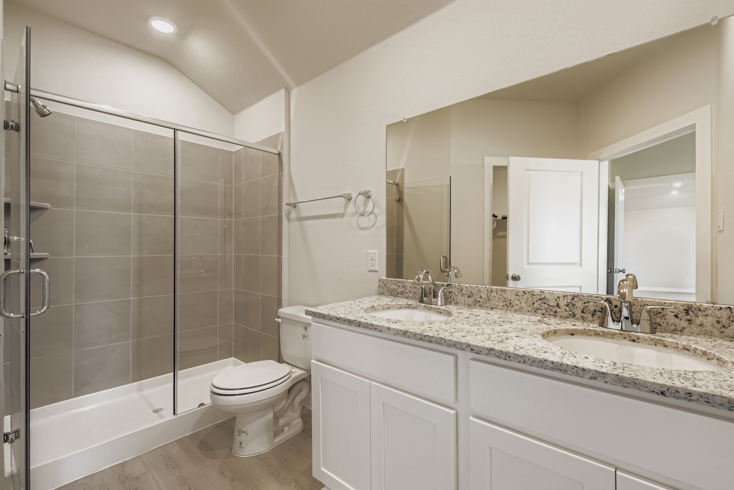 A bathroom with a glass shower.