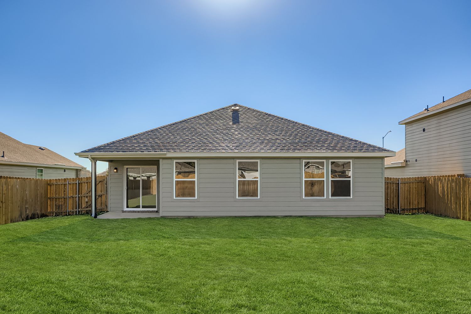 A house with a grass yard.