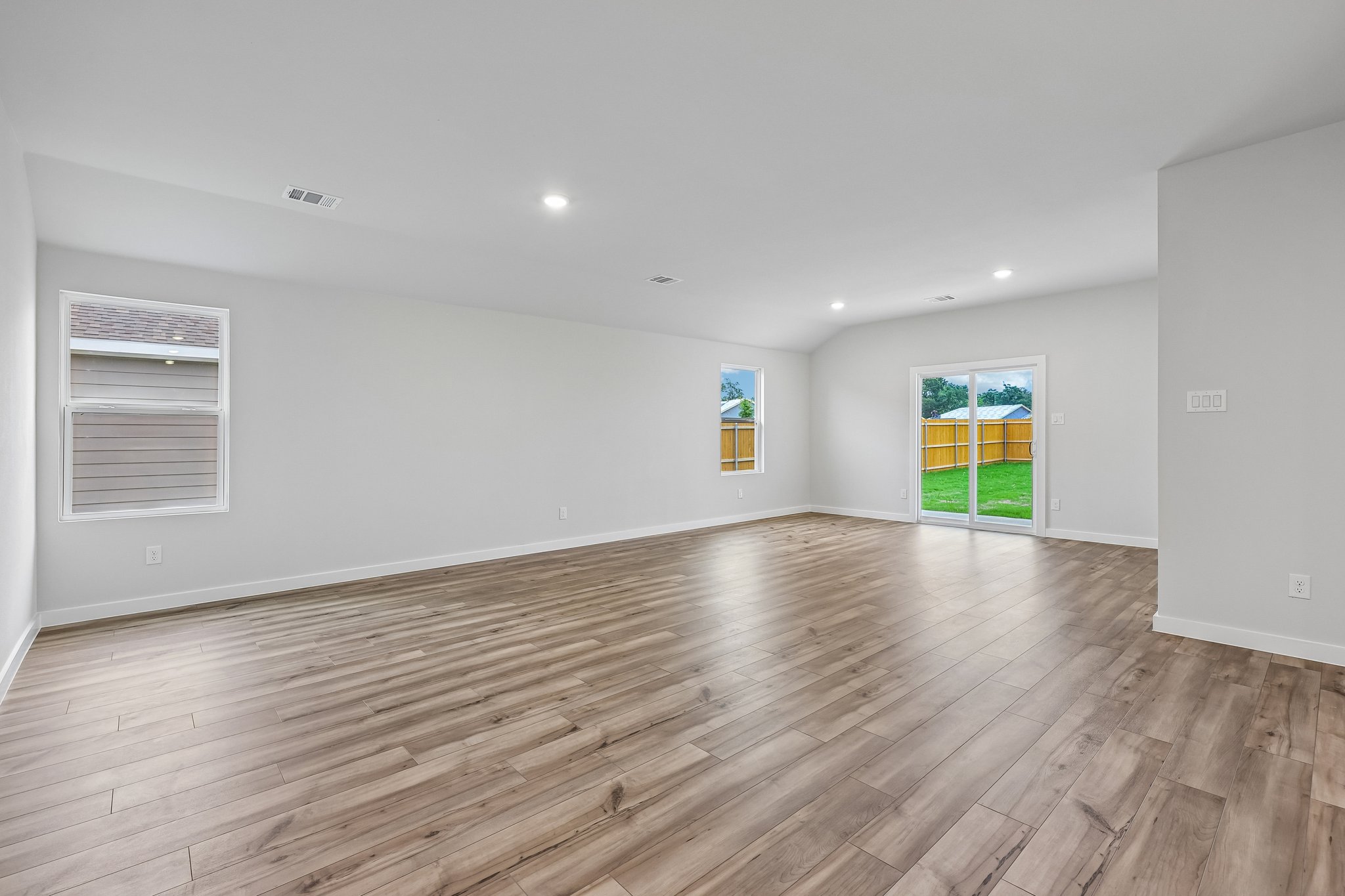 A room with wood floors.