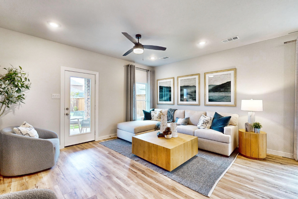 A living room with a couch and a table.