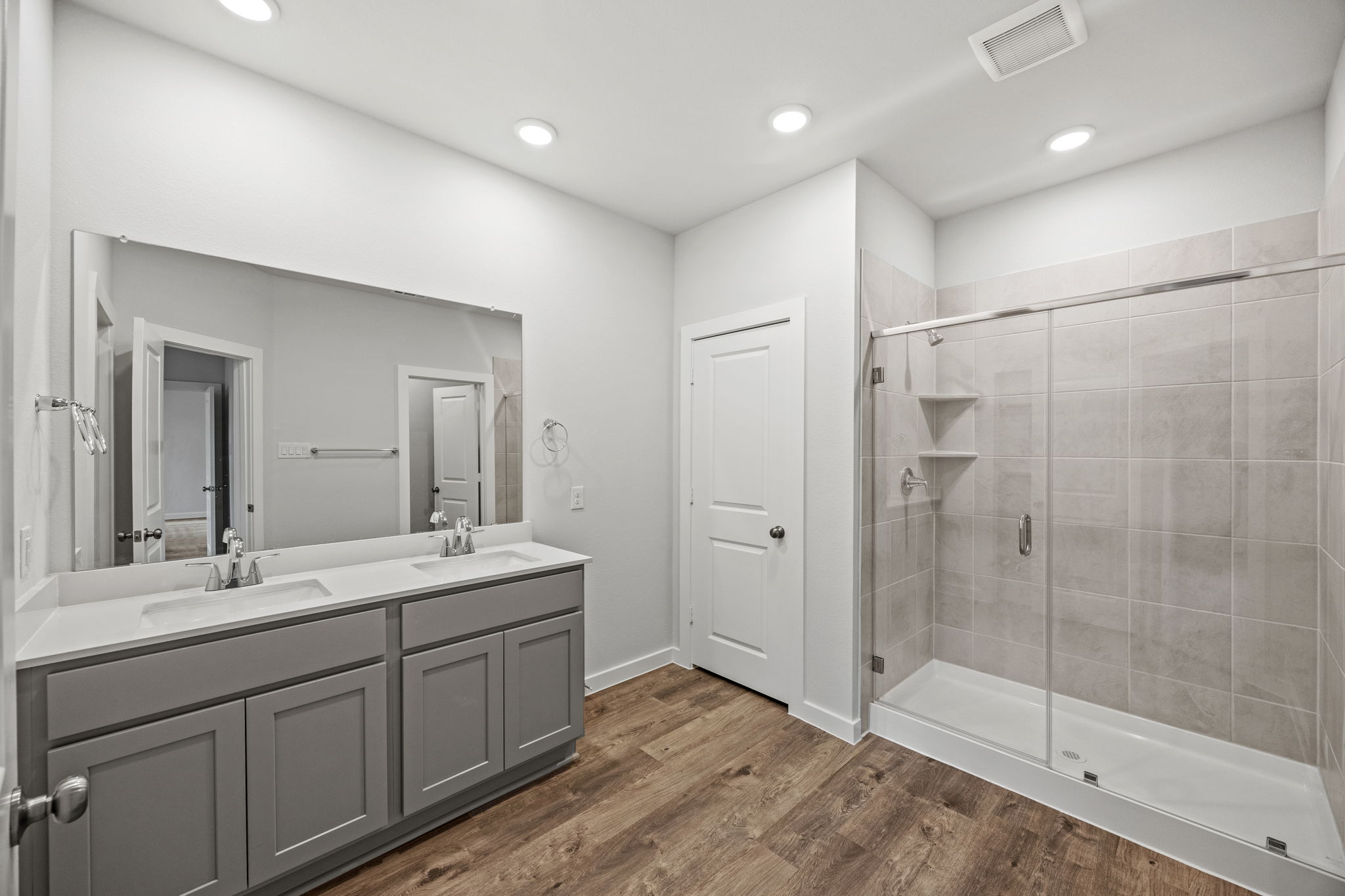 A bathroom with a glass shower.