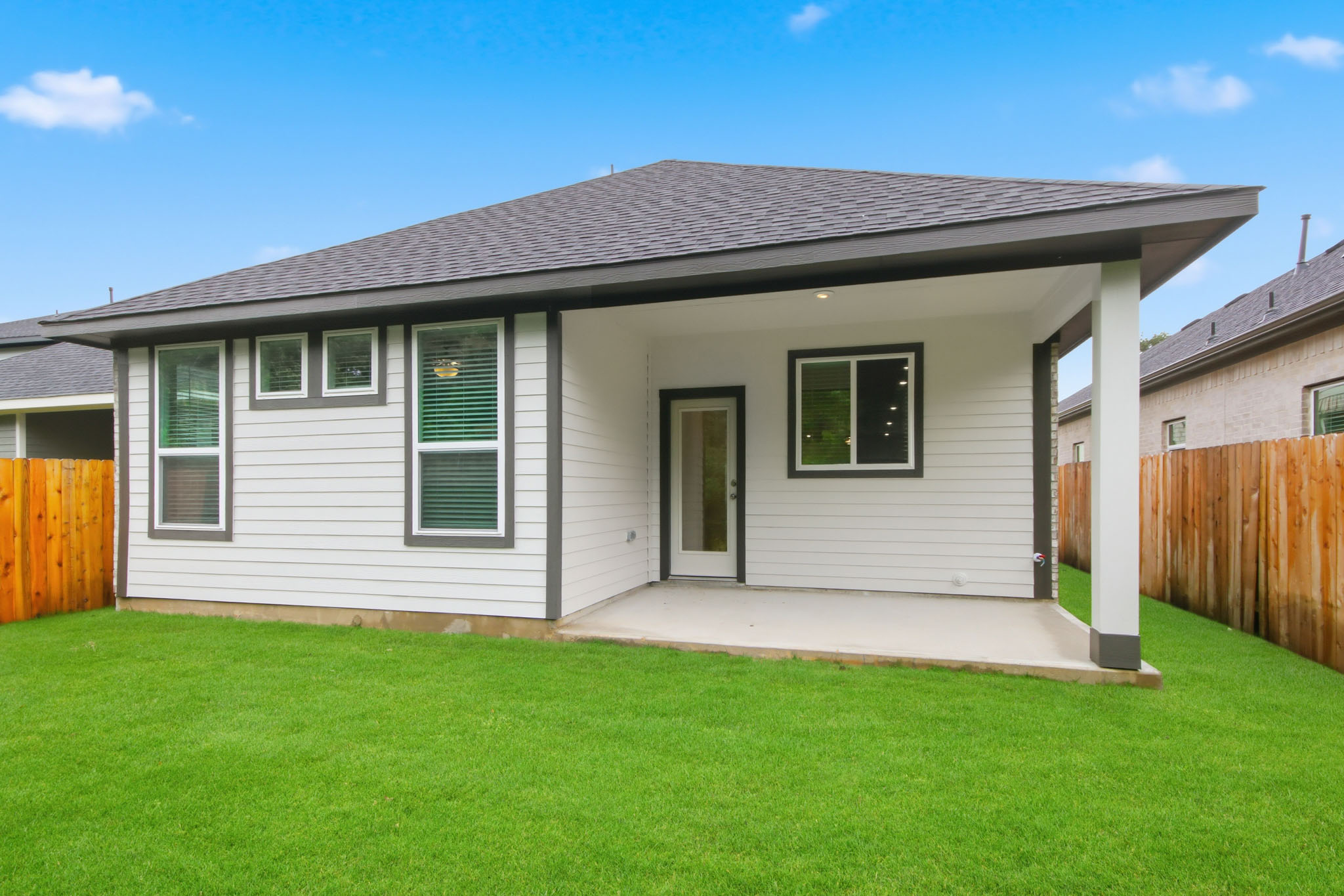 A house with a grass yard.