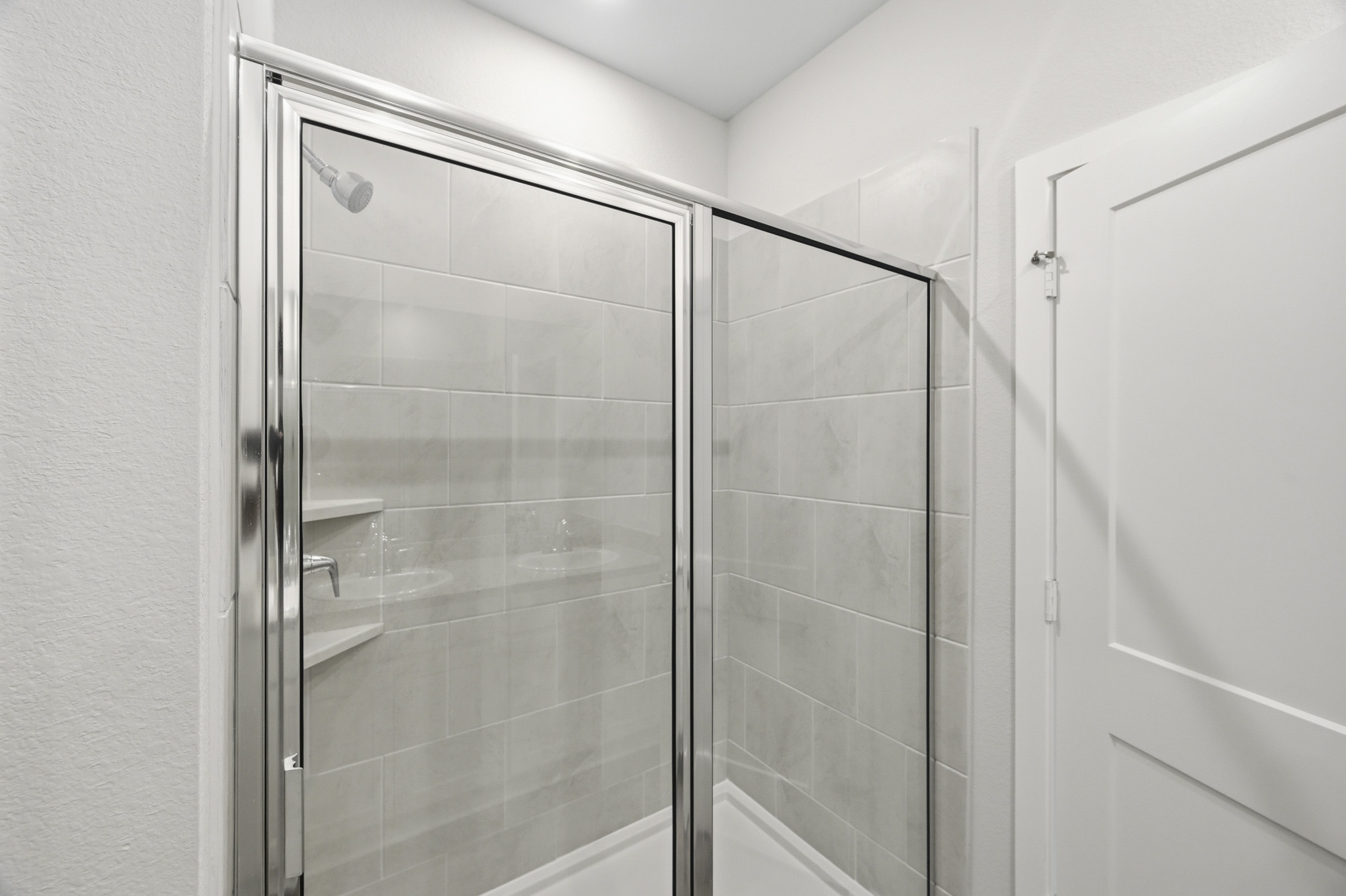 A shower unit in a bathroom.