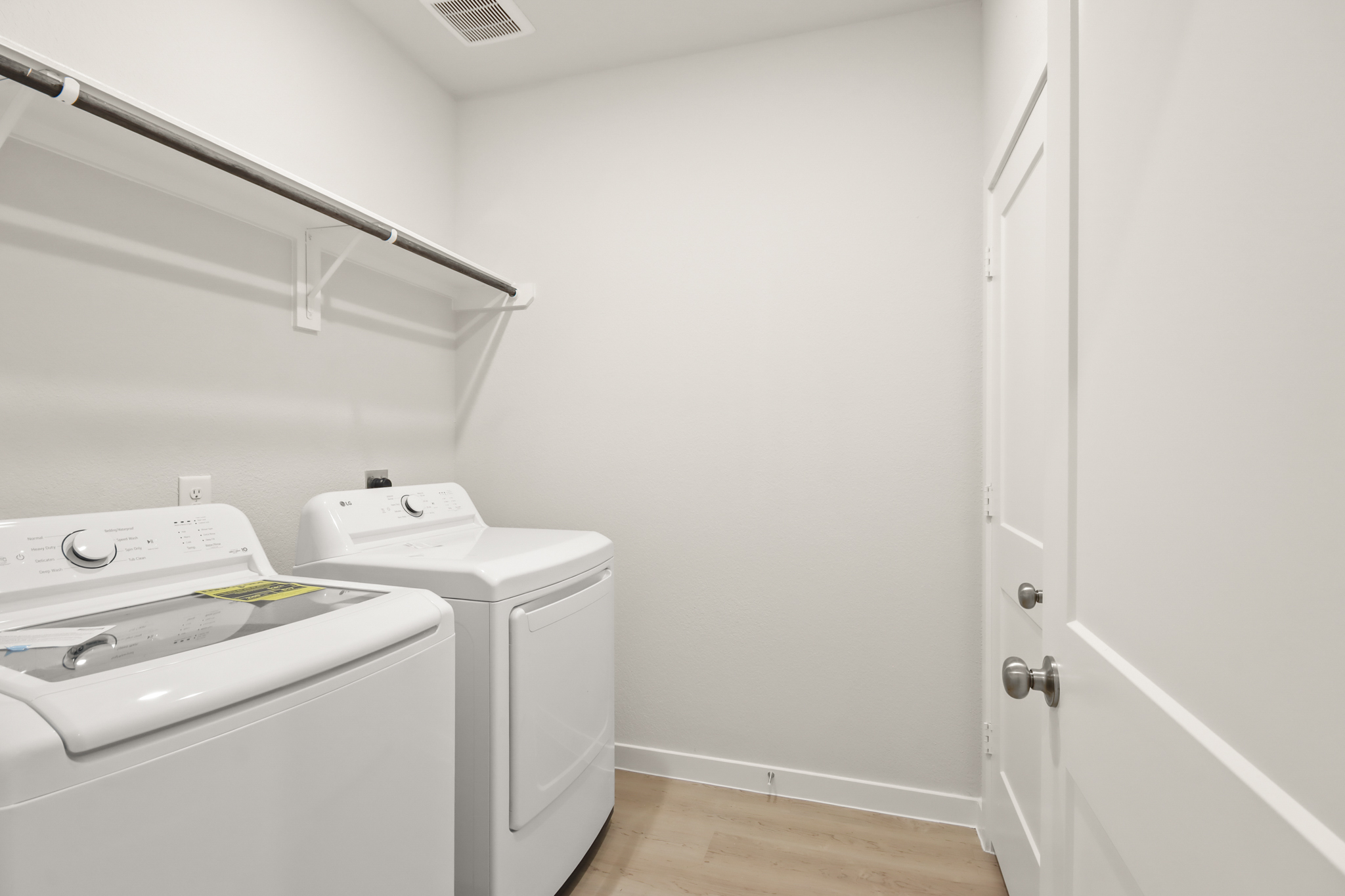 A washer and dryer in a room.