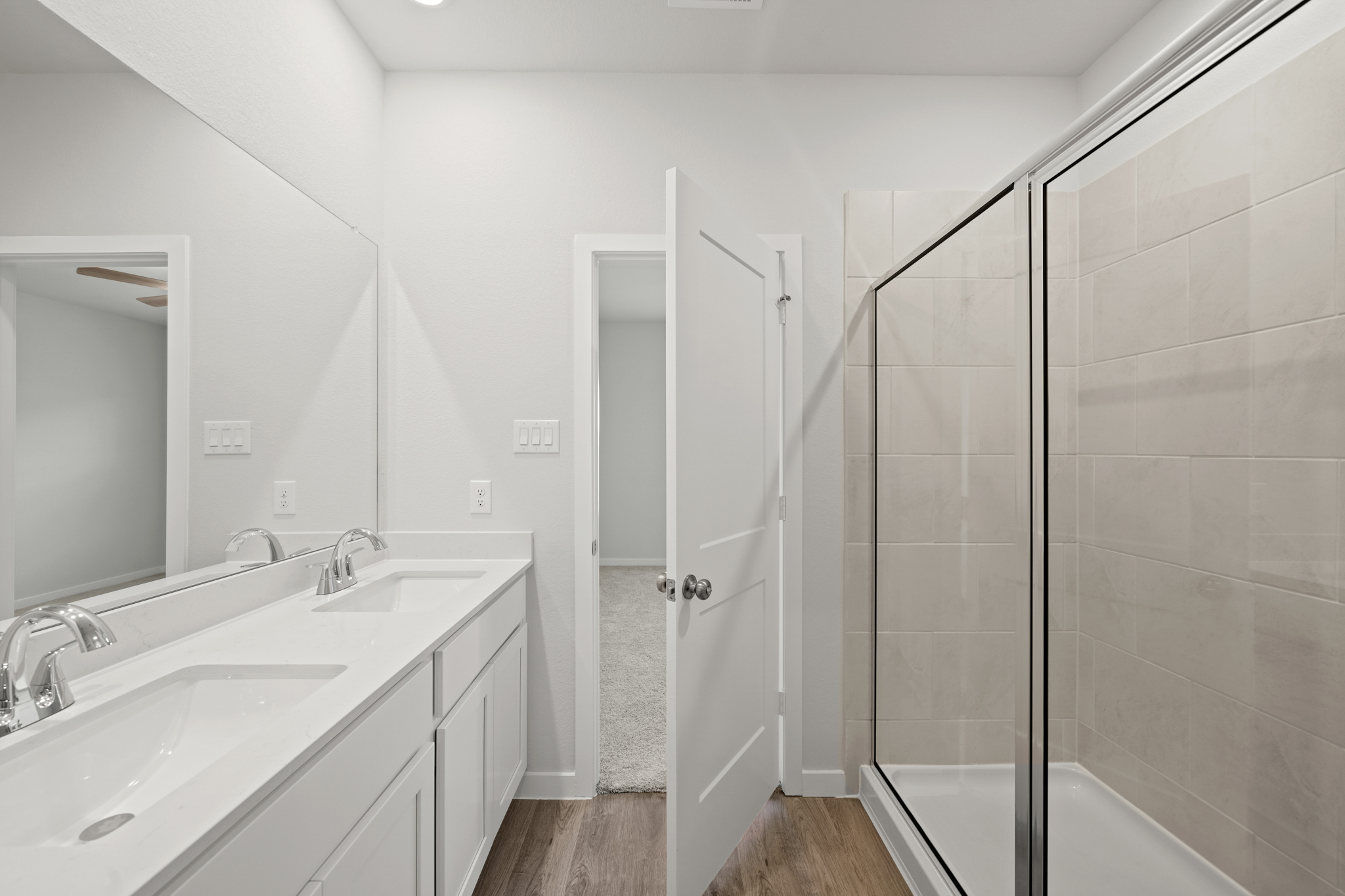 A bathroom with a glass shower.